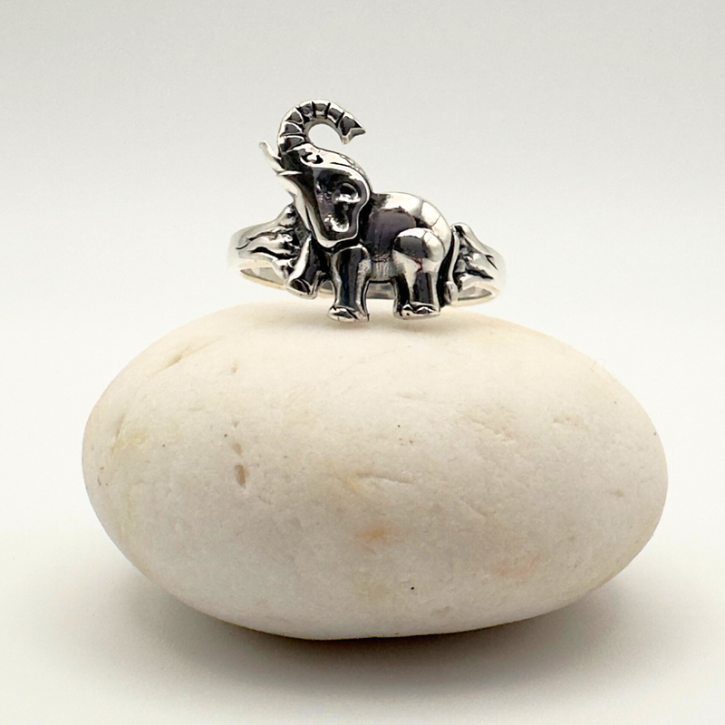 Load image into Gallery viewer, Silver elephant ring on a white stone with a white background
