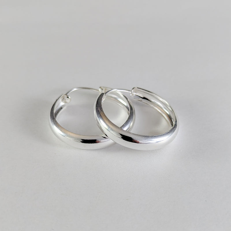 Load image into Gallery viewer, Hollow Curve Hoop Earrings in Sterling Silver (30mm)
