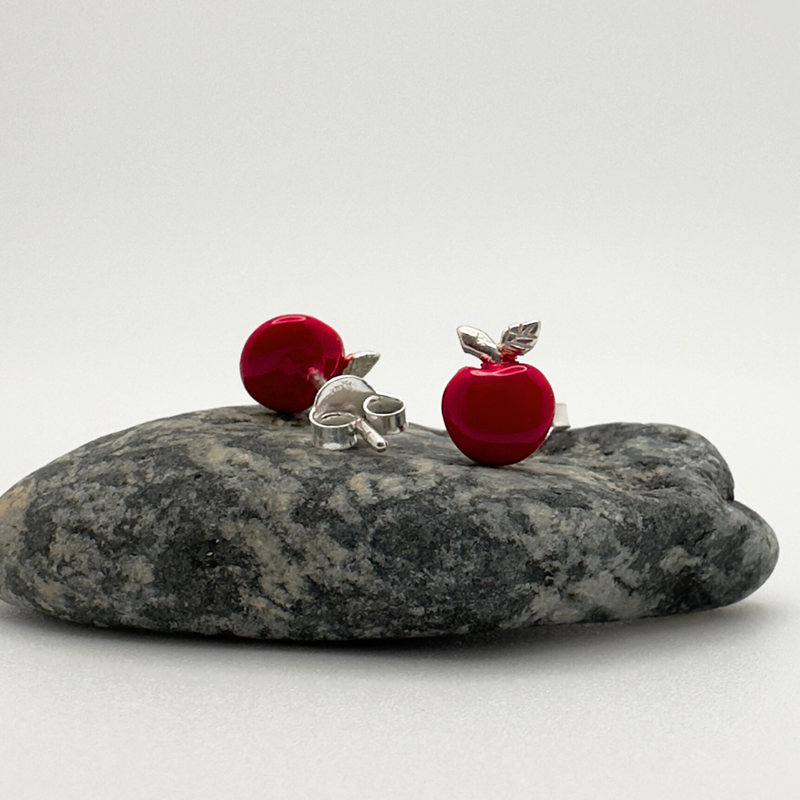 Load image into Gallery viewer, Red and silver earrings on a gray stone with a white background
