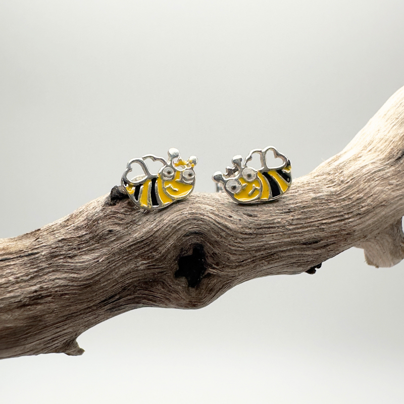 Load image into Gallery viewer, Bee-shaped earrings on a branch with a neutral background
