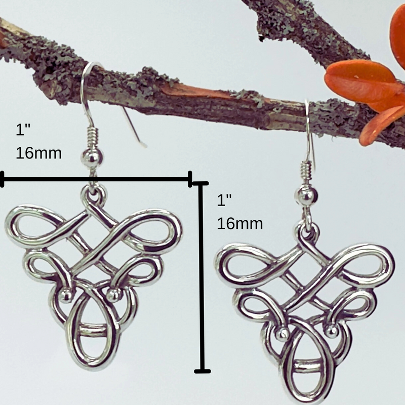 Load image into Gallery viewer, Silver Celtic knot earrings on a branch with measurement indicators.
