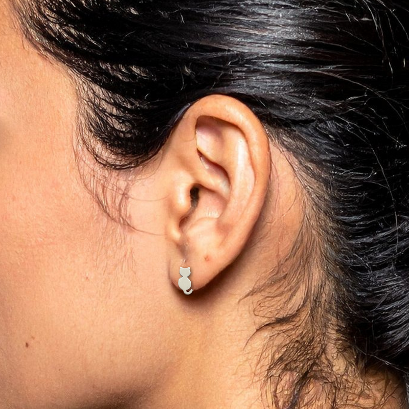 Load image into Gallery viewer, Close-up of an ear wearing a small earring with dark hair and blurred background
