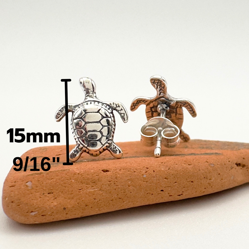 Load image into Gallery viewer, Turtle-themed earrings on a wooden stick with measurements indicated.
