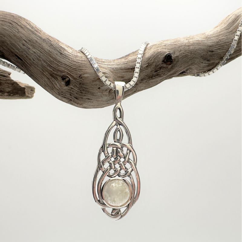 Load image into Gallery viewer, Silver pendant with a light-colored stone on a white background
