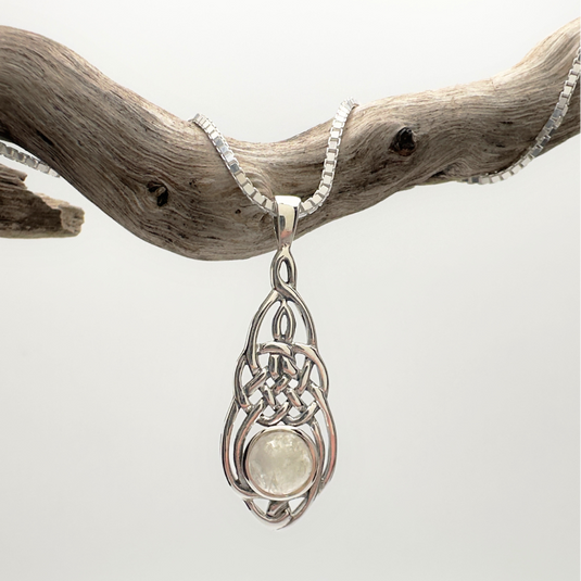 Silver pendant with a light-colored stone on a white background