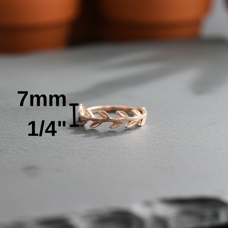 Load image into Gallery viewer, Rose gold ring with leaf design on a gray surface, measurement text overlay.

