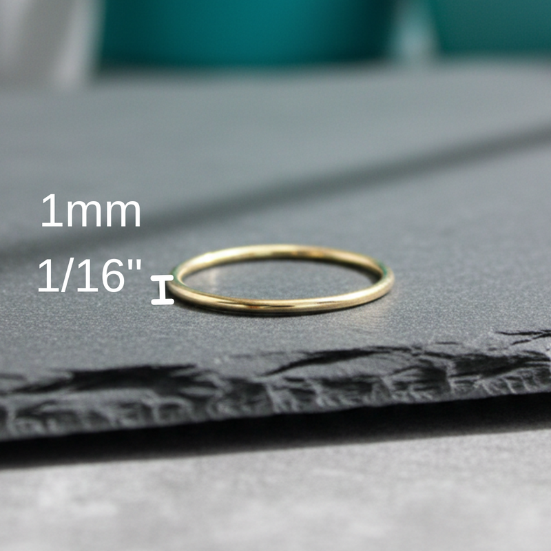 Load image into Gallery viewer, Gold ring on a gray surface with measurement text
