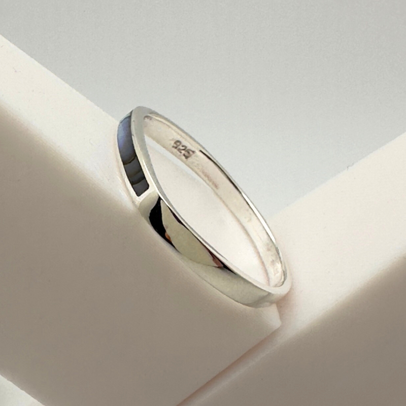 Load image into Gallery viewer, Silver ring on a white surface with a light gray background
