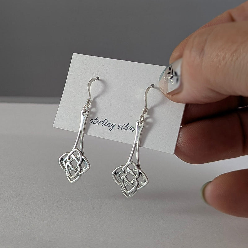 Load image into Gallery viewer, Never Ending Knot Drop Earrings in Sterling Silver
