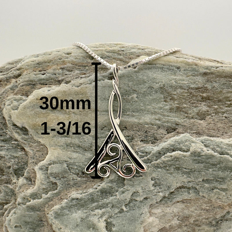 Load image into Gallery viewer, Silver pendant on a rock with measurement details
