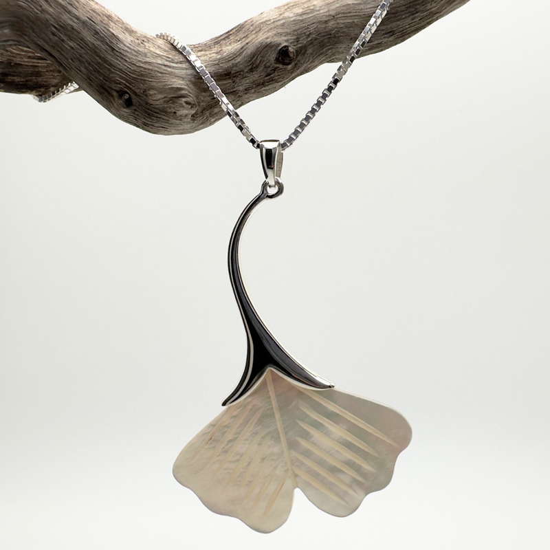 Load image into Gallery viewer, Necklace with a ginkgo leaf pendant on a branch against a white background
