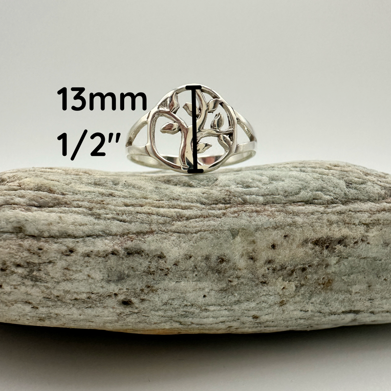 Load image into Gallery viewer, Silver tree-of-life ring on a rock with measurements displayed
