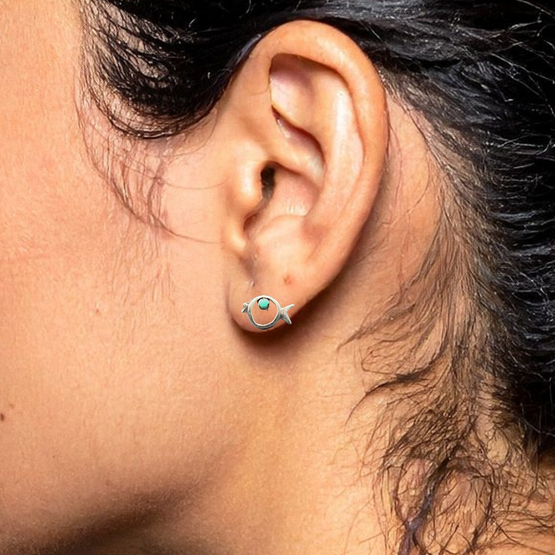 Load image into Gallery viewer, Close-up of an ear wearing a small earring with a dark background

