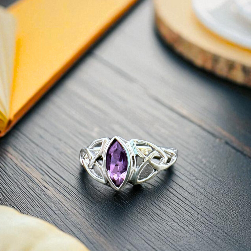Load image into Gallery viewer, Silver ring with an amethyst gemstone on a wooden surface
