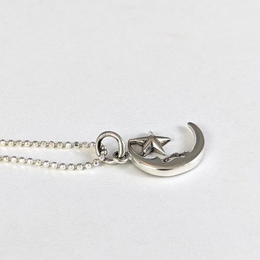 Man in the Moon Protects His Little Star Necklace in Sterling Silver