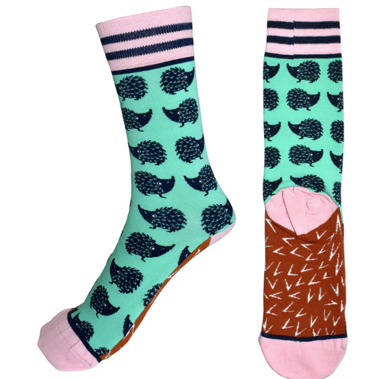 Colorful socks with hedgehog pattern on a white background
