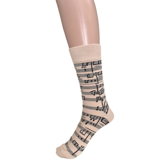 Sock with music note pattern on a mannequin foot against a white background