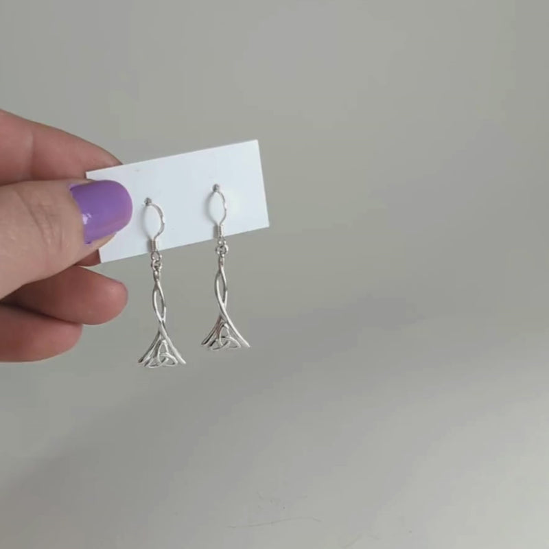 Load and play video in Gallery viewer, Dangling Trinity Knot Earrings in Sterling Silver
