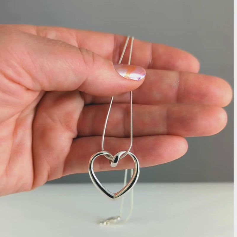 Load and play video in Gallery viewer, Looped Heart Necklace in Sterling Silver
