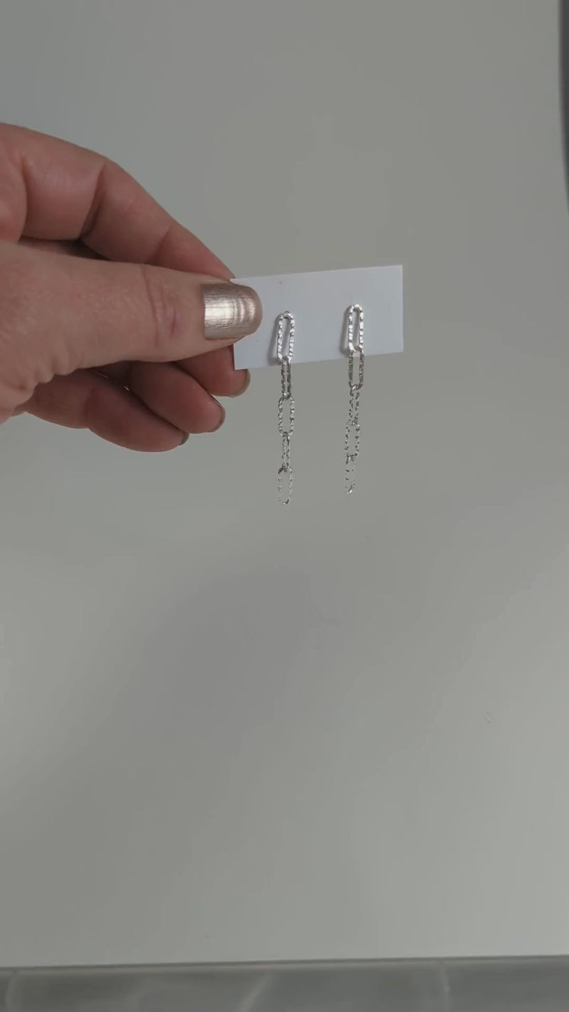 Load and play video in Gallery viewer, Hammered Paperclip Dangle Stud Earrings in Sterling Silver
